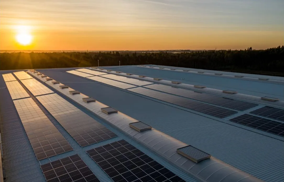 Solar panels at sunset — store the day's energy in a battery Solar panels on an Australian roof at sunset generating evening energy savings